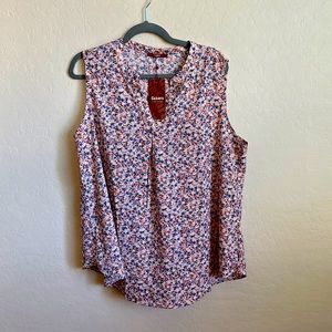 Sleeveless floral blouse. Never worn. Tags intact.